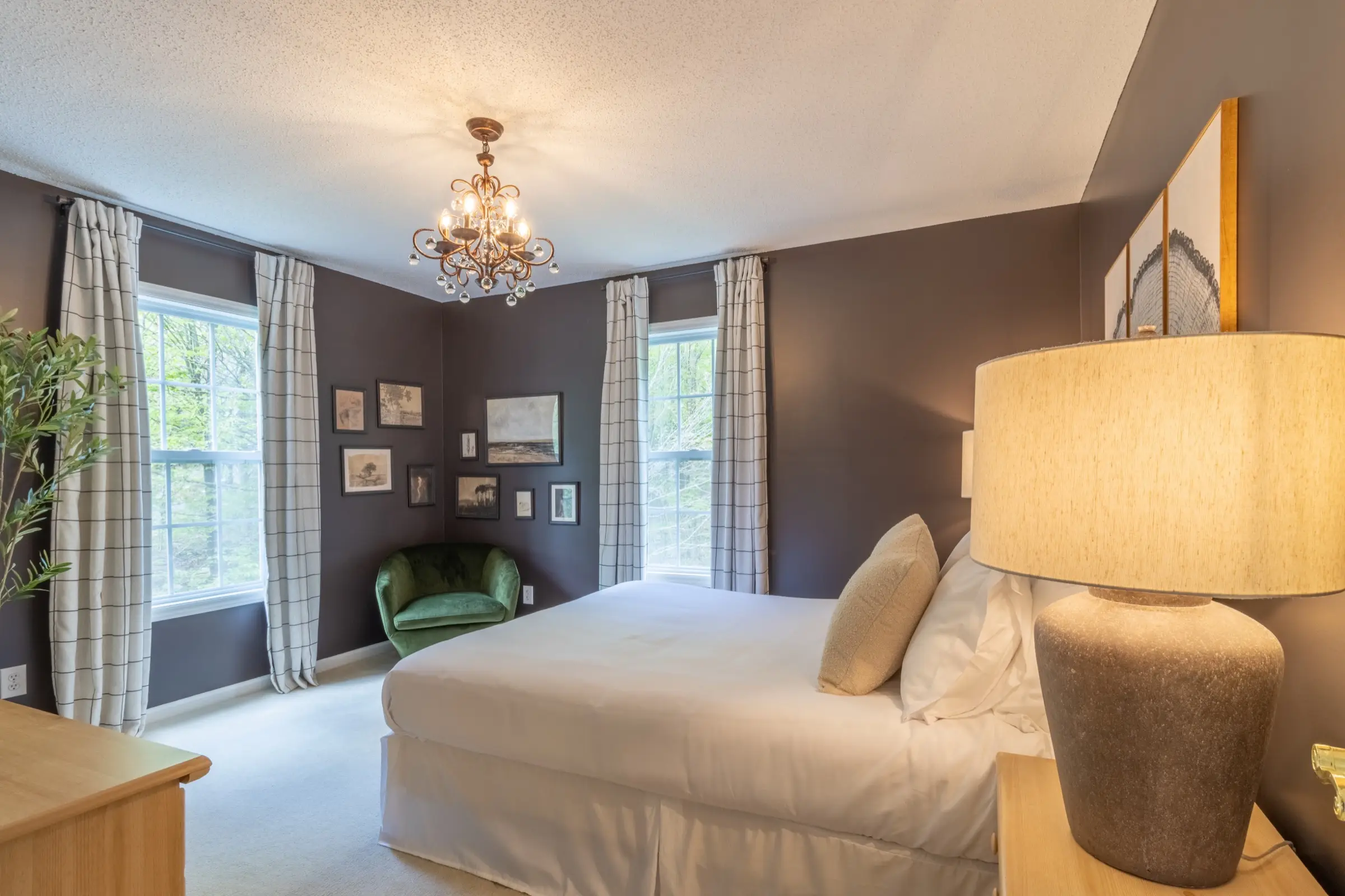 Upstairs bedroom 3, with a queen bed and a crystal chandelier.