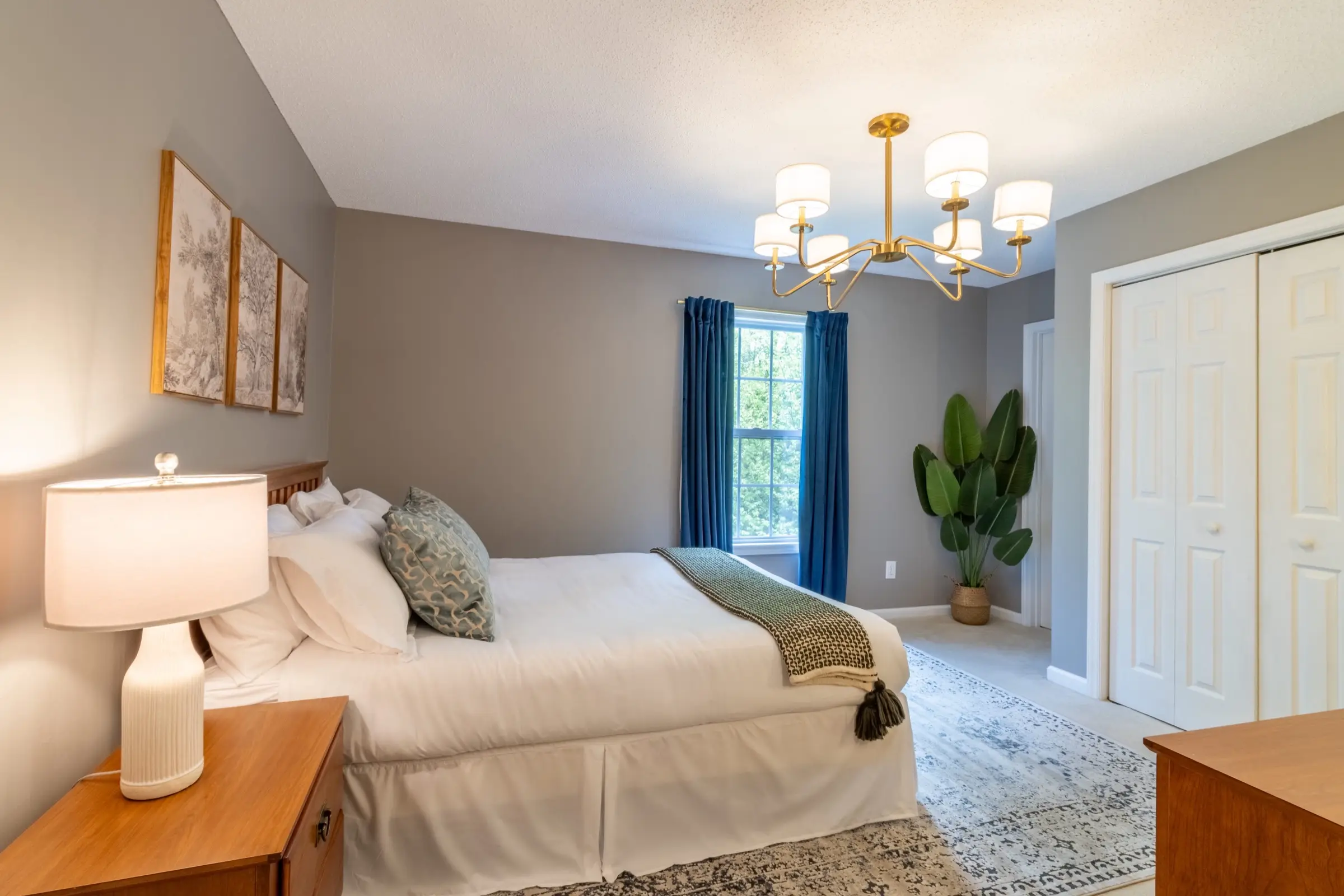 Upstairs bedroom 4, with a queen bed and blue curtains at the window.
